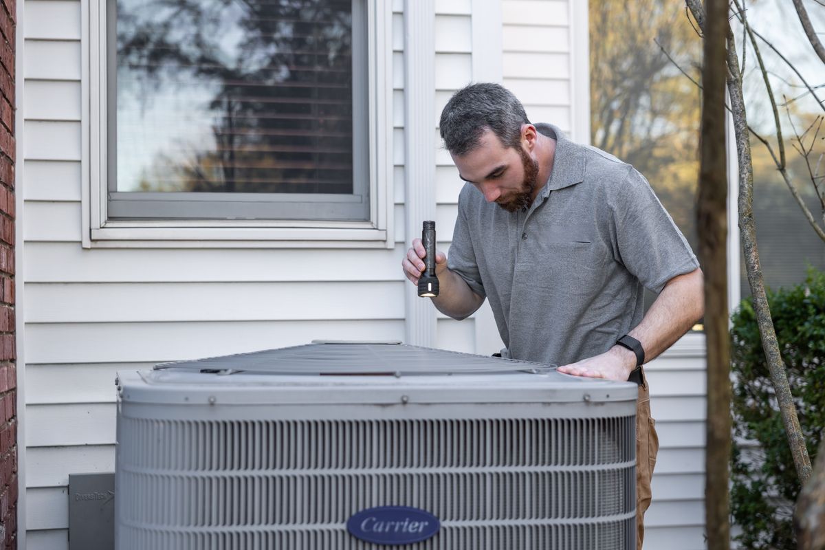 Contractor Insurance Utah Utah HVAC contractor servicing equipment
